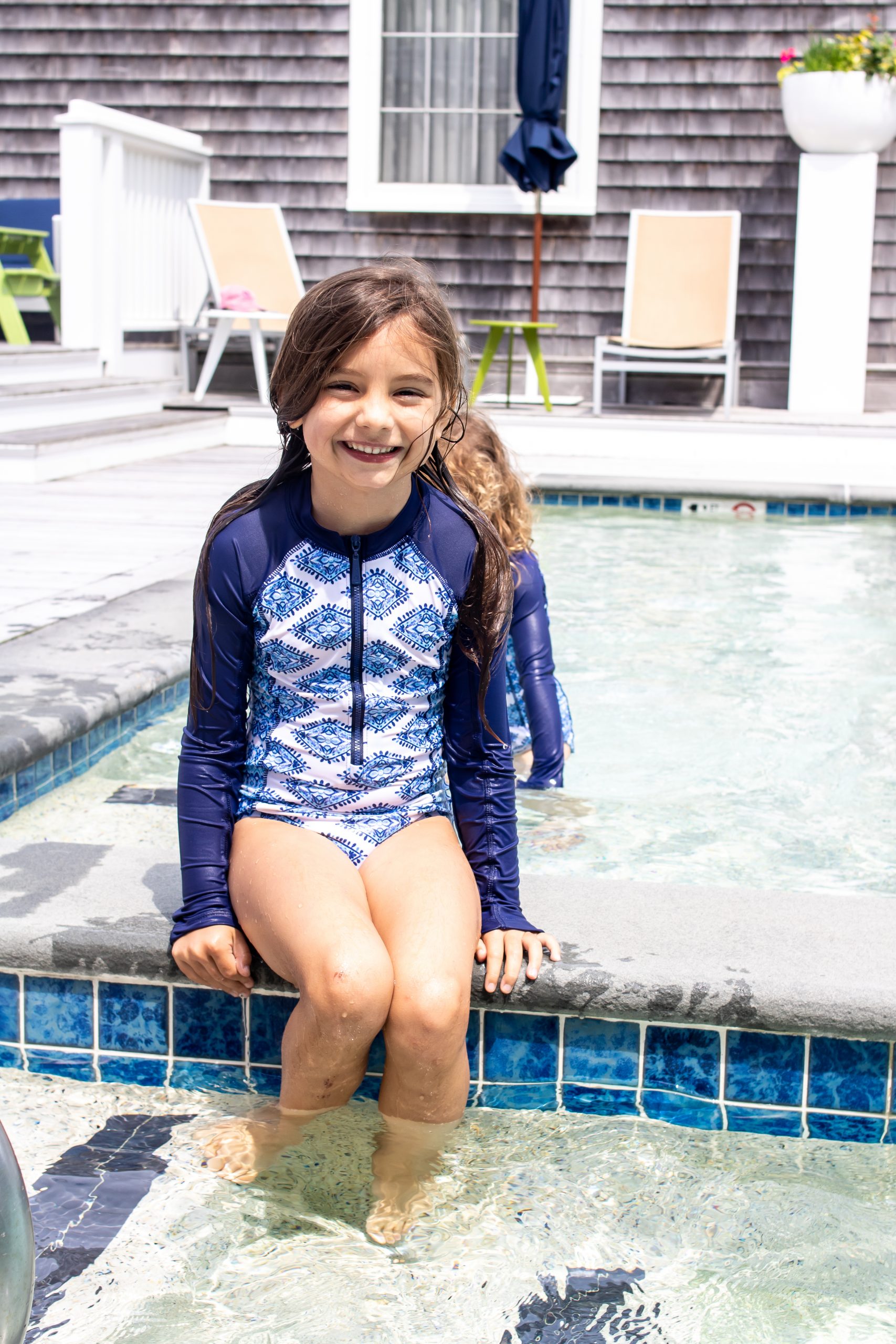 Little girls wearing sun safe Cabana life unisuit bathing suit at the Nantucket Hotel and Resort